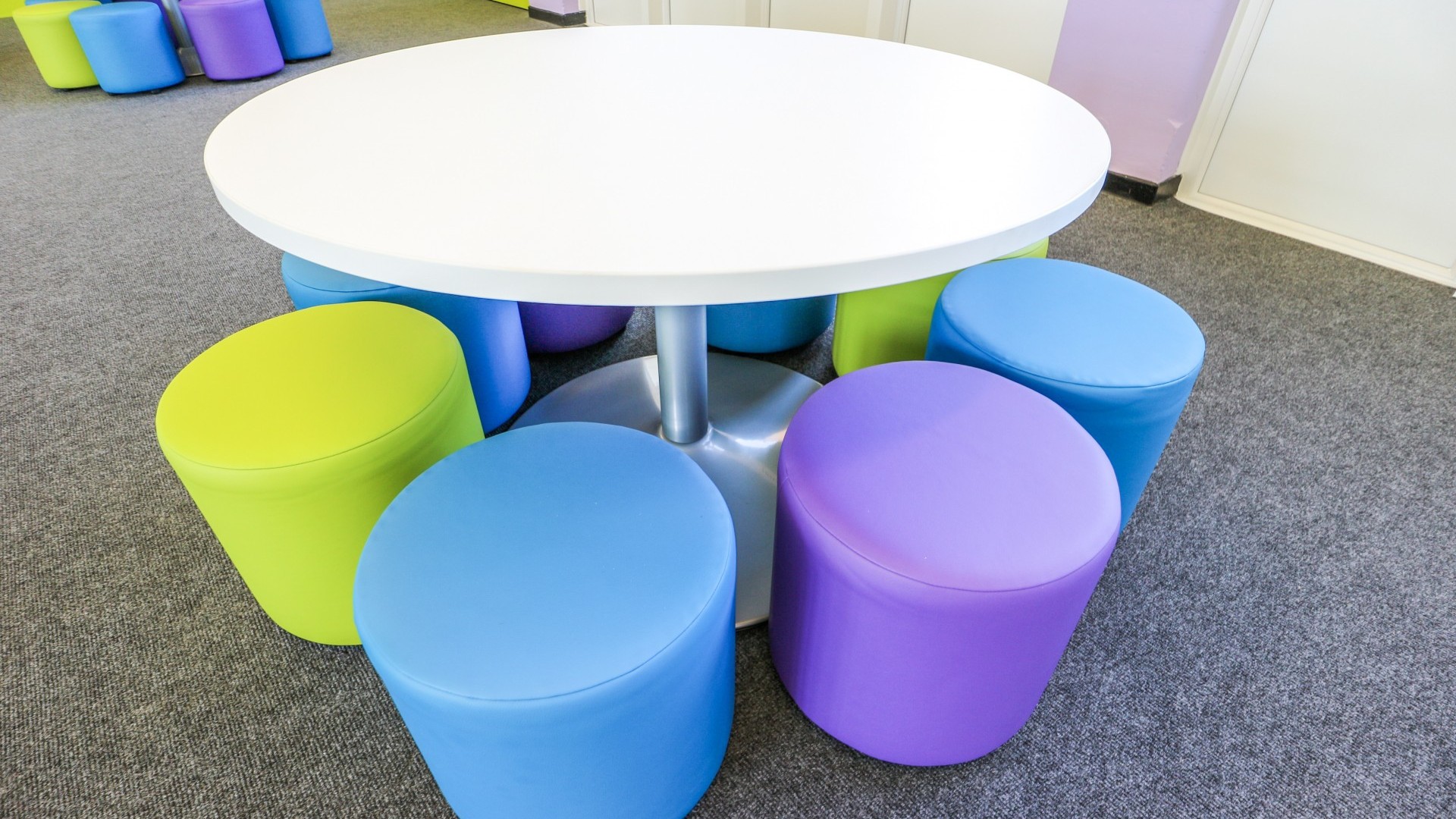Kindergarten Activity Table with Colorful Pouf Stools