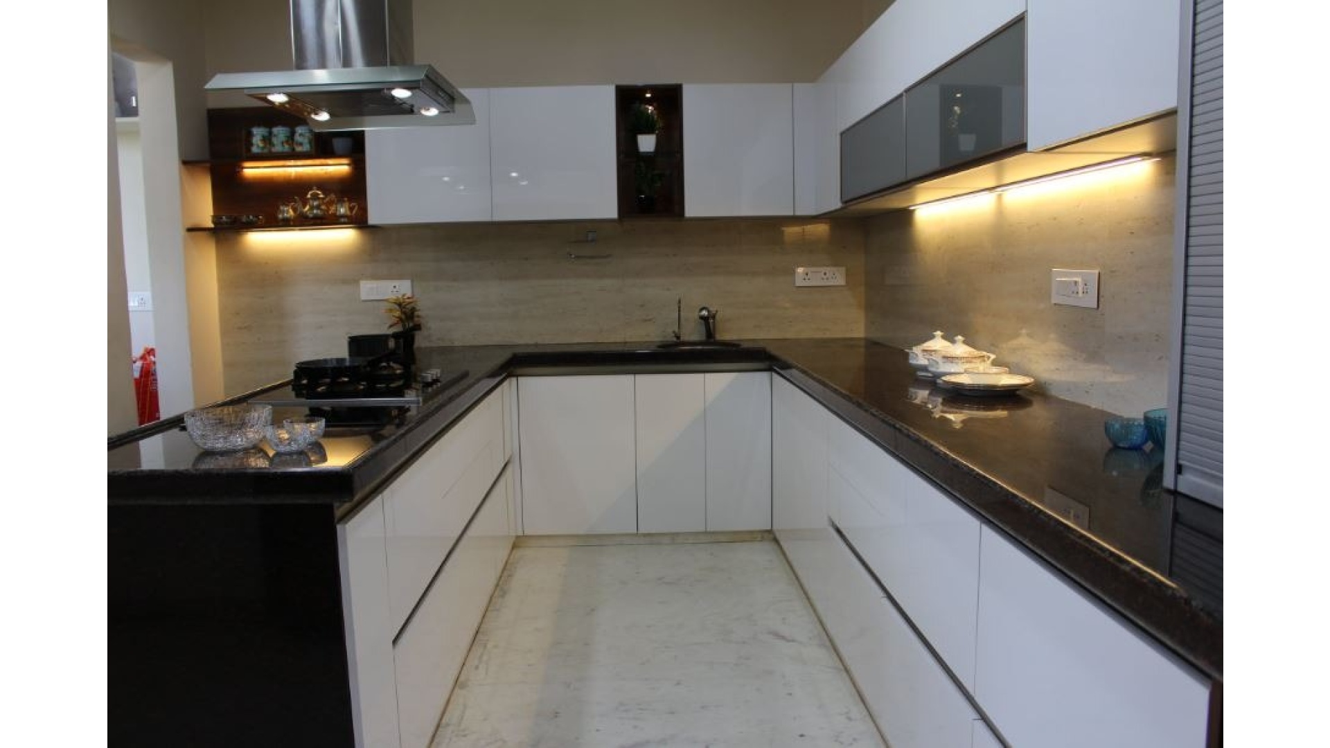 U-Shaped High-Gloss White Kitchen with Granite Countertops